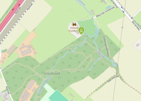 Kaart van Grasbroek met Kasteel Grasbroek en wandelpaden, omgeven door groen en water.