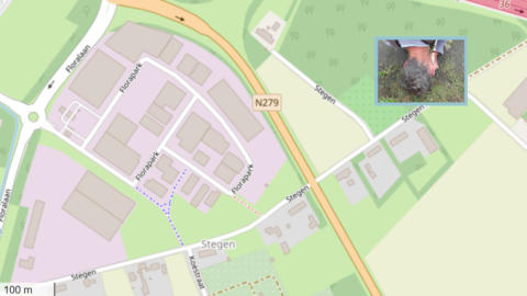 Kaart van Florapark met wegen, gebouwen en N279. Inzetfoto toont persoon op grond kijkend.