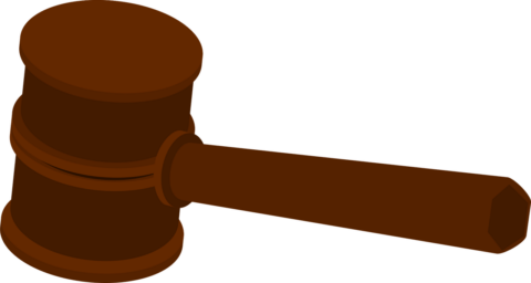 Illustratie van een bruine hamer, typisch gebruikt in rechtspraak.