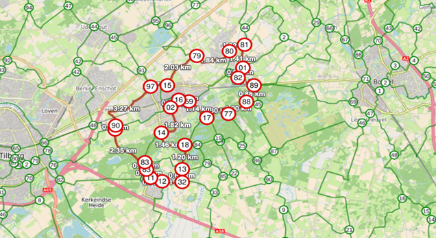 Kaart van een fietsnetwerk rond Tilburg, met genummerde knooppunten en afstanden in kilometers.